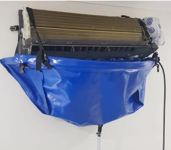 A split system with a blue catch bag fitted underneath it