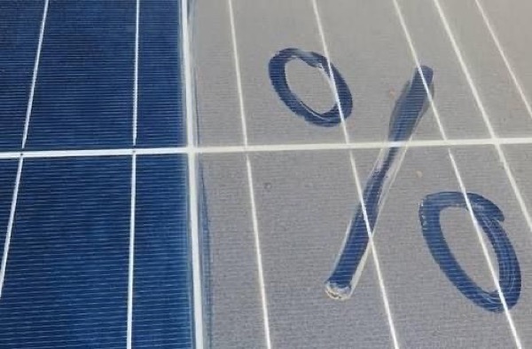 A close view of dirt marks across the glass of a solar panel