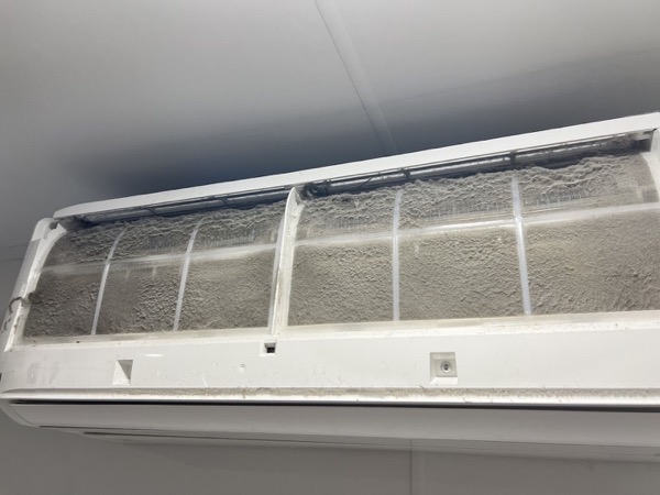 An indoor split system head with its cover open