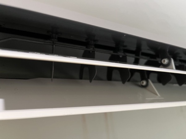 A close view of the vanes inside an air conditioner head