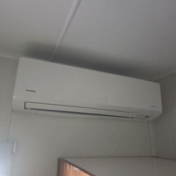 A wall-mounted split system on the wall of a room